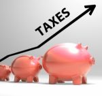 Taxes Arrow Shows Higher Taxation And Levies Stock Photo