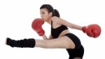 Kickboxing Girl Giving Strong Kick With Her Leg Stock Photo
