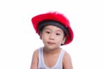 Boy In A White Singlet Wearing Red Helmet Stock Photo