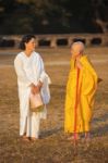 Two Unidentified Buddhist Female Monks Dressed In Orange And Whi Stock Photo