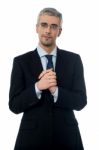 Business Man With Clasped Hands Stock Photo
