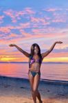 Beautiful Black African American Woman Posing On The Beach At Sunset Stock Photo