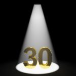 Golden Number 30 With Spotlit Stock Photo