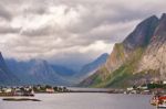 Norway Village On A Fjord. Nordic Cloudy Summer Day Stock Photo