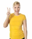 Girl Doing Victory Sign Stock Photo