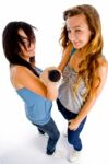 High Angle View Of Females Holding Microphone Stock Photo