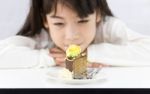 Little Girl Looking At Cake Stock Photo