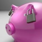 Piggybank With Locked Ears Shows Savings Safety Stock Photo