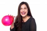 Cheerful Woman With Red Balloon Stock Photo