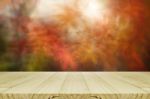 Pine Wood Counter With Blurred Autumn Leaves Background Stock Photo