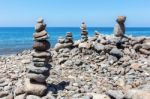Stacked Beach Stones At Blue Sea Stock Photo