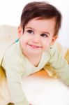 Cute Baby Smile Under Yellow Blanket Stock Photo