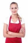 Pretty Chef Dressed In Red Apron Stock Photo