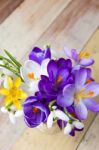 Bunch Of Spring Flowers. Crocus And Snowdrops On The Wooden Back Stock Photo