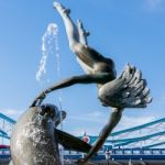 David Wayne Sculpture "girl With The Dolphin" Next To Tower Brid Stock Photo