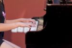 Girl Plays Piano Stock Photo