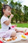 Little Asian (thai) Girl Enjoy Eating Her Lunch Stock Photo