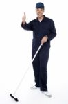 Cleaner Showing Thumb Up Gesture Stock Photo