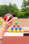 Arm With Ball To Throw Off Colored Blocks Stock Photo