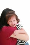 Girl Crying In Mothers Arm Stock Photo