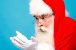 Santa Claus Looking His Open Palms Stock Photo