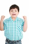 Eight Year Old Boy Clenching His Fists Stock Photo
