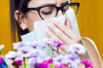 Allergic To Pollen Young Girl With A Bouquet Of Flowers Stock Photo