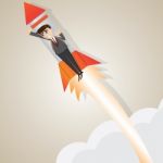 Cartoon Businessman Rising With Rocket Stock Photo