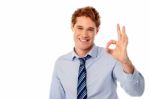 Male Executive Showing Okay Sign Stock Photo