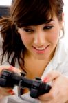 young Woman Playing Video game Stock Photo