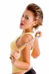 Side View Of Young Woman With Nunchaku Stock Photo