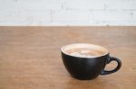 Hot Cup Of Coffee On Wooden Table Stock Photo