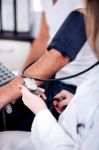 Female Doctor Checking Blood Pressure Stock Photo