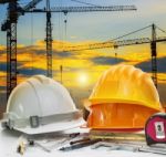 Civil Engineer Working Table With Safety Helmet And Writing Inst Stock Photo