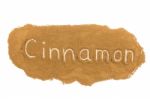 Word Written In Cinnamon Powder On White Background Stock Photo