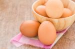 Eggs In A Wooden Bowl On The Table Stock Photo