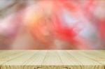 Pine Wood Table With Blurred Autumn Leaves Background Stock Photo