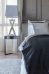Dark Color Scheme Modern Bedroom Design With Pillows Stock Photo