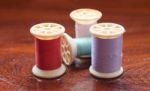 Vintage Grunge Colorful Thread Spool On Wooden Table Stock Photo