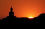 Sunset And Buddha Stock Photo