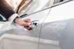 Chauffeur S Hand On Handle. Close-up Of Man In Formal Wear Openi Stock Photo