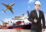 Working Man And Commercial Ship On Port And Air Cargo Plane Flyi Stock Photo