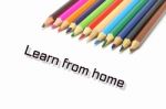 Learn From Home Text With Coloful Colored Pencil Stock Photo