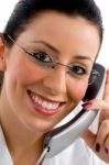 smiling lady talking over landline Stock Photo