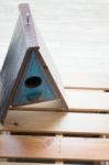 Wooden Bird House Decorated On The Table Stock Photo