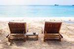 Beach Chairs On The White Sand Beach With  Blue Sky And Sun Stock Photo