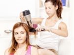 Teenage Girl Dries Hair To Her Friends Stock Photo