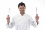 Handsome Chef Holding Knife And Fork In Hands Stock Photo