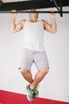 Closeup Of Young Strong Teenage Athlete Doing Pull-up On Horizon Stock Photo