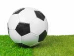 Soccer Ball On The Field, White Background Stock Photo